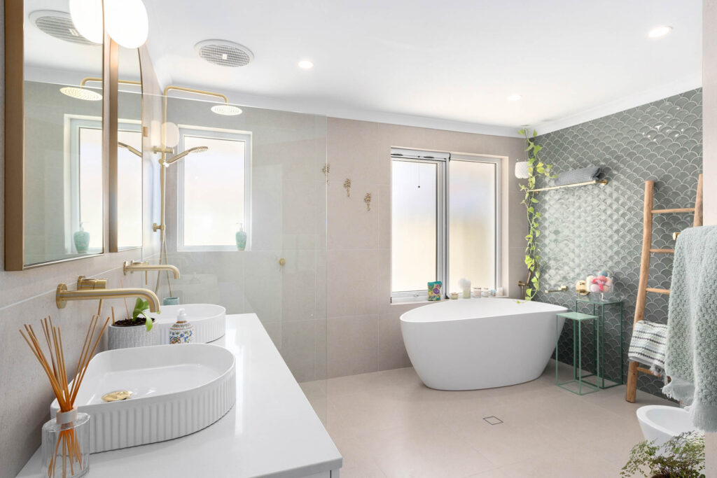 Beautiful master bathroom in a newly renovated Perth home. Showcasing a large free standing bathtub, a feature wall and double vanity. The perfect bathroom inspiration for your next home build.